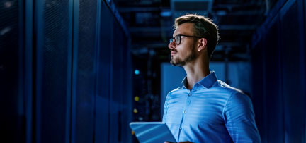 A person holding a tablet in a datacenter 